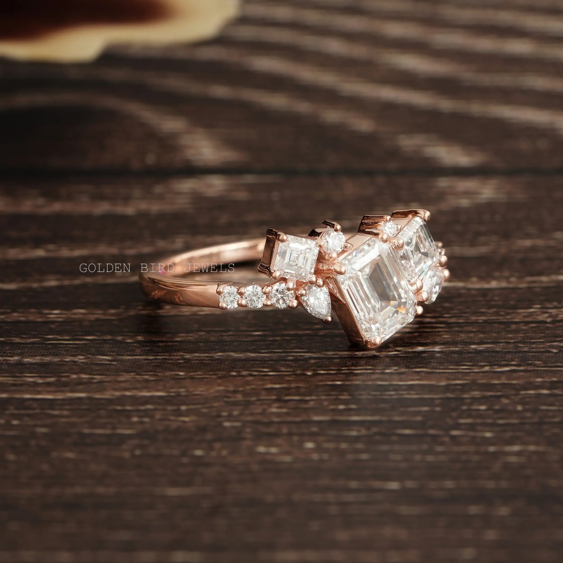 Side View Of Multi Stone Cluster Engagement Ring In Rose Gold