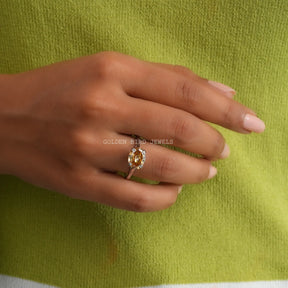 In Finger Front View Of Champagne Step Cut OVal Moissanite Double Prong East West Set Solitaire Ring Made In Solid Gold
