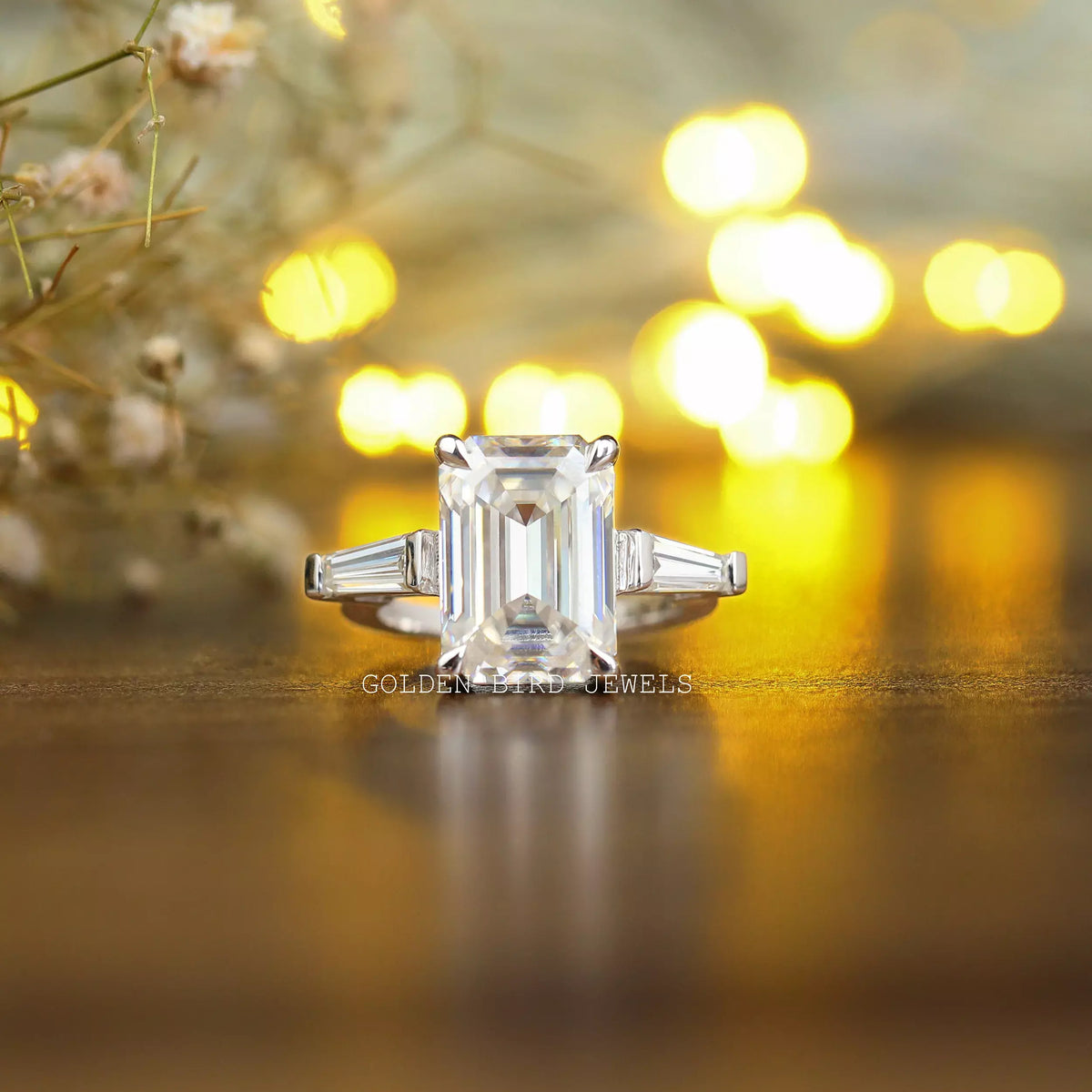 View of Three Stone Emerald Cut Moissanite Anniversary Ring In White Gold