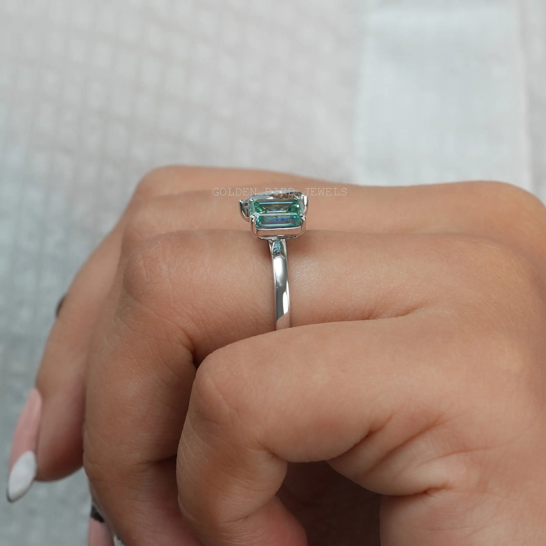 In Finger Side View Of Fancy Blue Emerald Cut Moissanite Two Stone Wedding Ring For Her