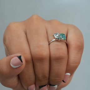 In Finger Front View of Pear & Emerald Cut Toi Et Moi Moissanite Engagement Ring Made With 950 Platinum